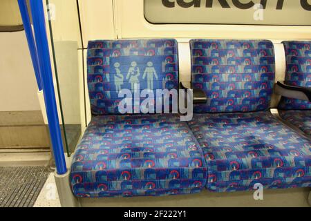dirty priority seat for disabled pregnant or elderly customers or passengers on london tube carriage Stock Photo