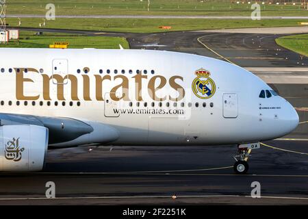 Emirates Airlines Airbus A380 passenger plane departing Dusseldorf Airport. Germany - December 17, 2015 Stock Photo