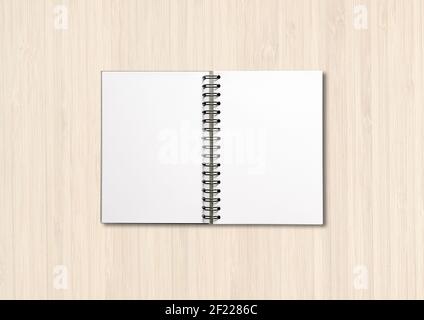Blank open spiral notebook isolated on white wood Stock Photo