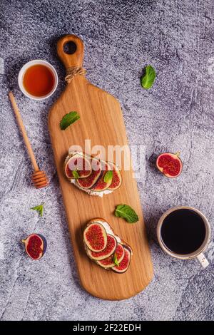 Homemade summer toast with cream cheese and figs, top view. Stock Photo