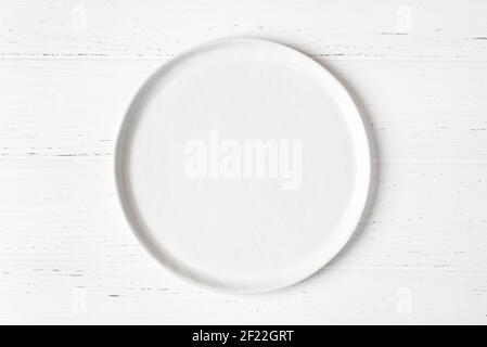 An empty plate on a white table. Stock Photo