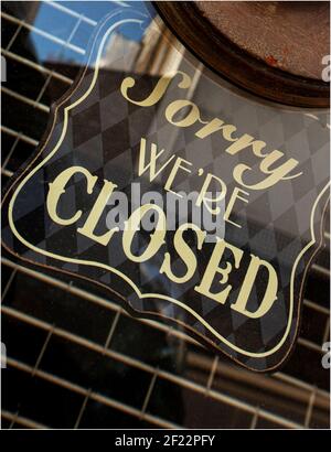 Sign on shop doorway 'Sorry we're closed' Stock Photo