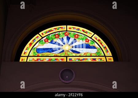 Budapest, Hungary - March 5, 2021: Hemisphere colorful stained glass window in a staircase of a on residential house with tee house terrace in Budapes Stock Photo
