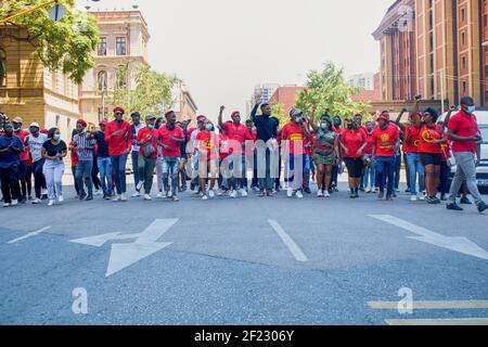 PRETORIA, SOUTH AFRICA - Mar 09, 2021: A group of EFF marches down Vermeulen Street in Pretoria Central on Thursday 04 March 2021, marching against st Stock Photo