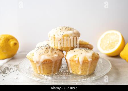 A stack of delicious homemade lemon poppy seed muffins on bright background. Stock Photo