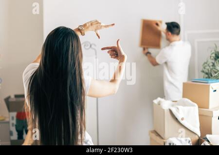 young couple arranging things in their new apartment . Stock Photo