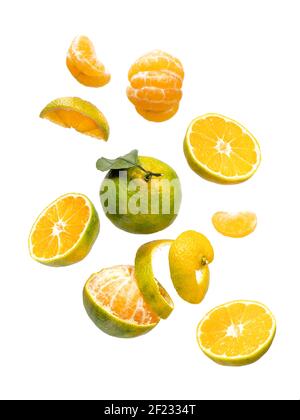 Green mandarines slices and whole levitation Stock Photo