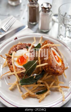 *For use in the Evening Standard only - charges may apply*  Ape & Bird, Central London Pic Shows:  Pigs Trotter Scotch Egg & Celeriac Fries Stock Photo