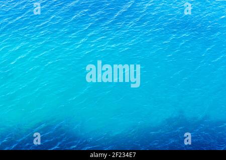 Ripple of blue sea water. Textured sea water background. Top view. Stock Photo