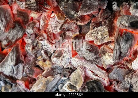Background of burning hot coals in the barbecue grill. Stock Photo