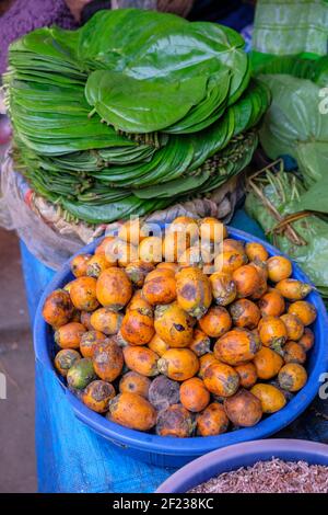 Areca nut and betel leaves in the Guwahati market. The areca nut is the seed of the areca palm and is commonly known as betel nut. Stock Photo