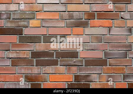 Background from a brick wall with different shades of red Stock Photo