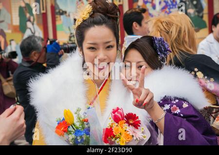 Two Japanese ladies dressed in kimonos on Coming of Age Day (Seijin no hi) to celebrate turning 20 and becoming adults, Asakusa, Tokyo, Japan Stock Photo