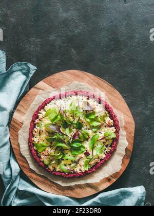 Beetroot pizza crust with fresh mangold leaves Stock Photo