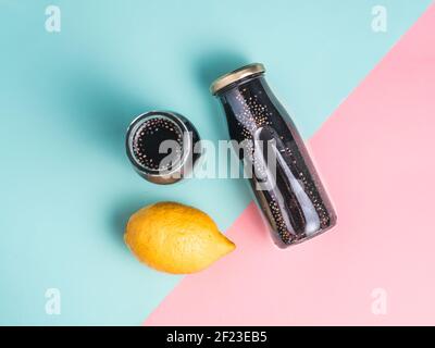 Detox activated charcoal black chia lemon water Stock Photo