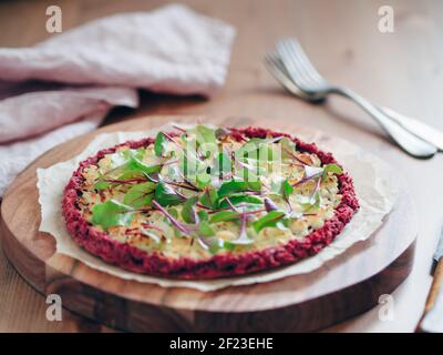 Beetroot pizza crust with fresh mangold leaves Stock Photo