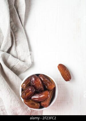 Plate of dried dates on table Stock Photo