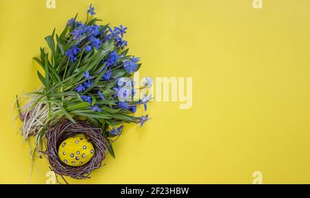 Easter background. Easter flowers. Easter eggs. Happy Easter card. Multicolored Easter eggs. Stock Photo
