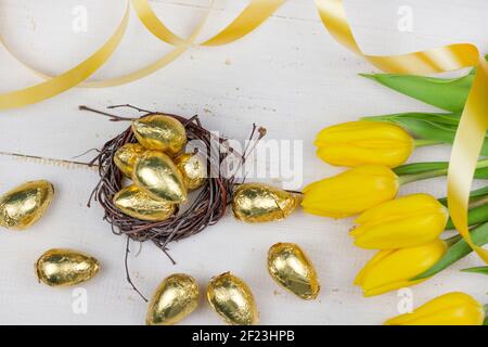 Easter eggs. Happy Easter card. Multicolored Easter eggs. Easter. Easter eggs on a white wooden background. Easter background. Stock Photo