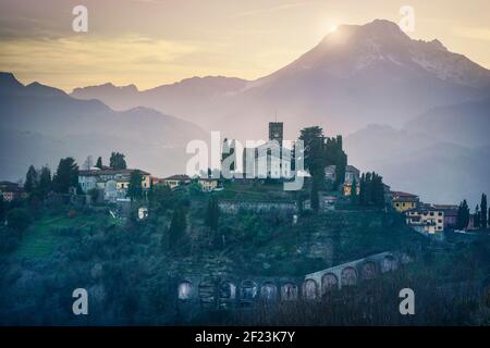 Barga town and Alpi Apuane mountains in winter. Garfagnana, Tuscany, Italy Europe Stock Photo