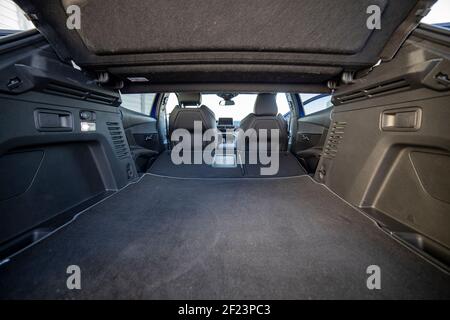empty trunk of a modern car with folded rear seats. large interior volume. trunk view. Stock Photo