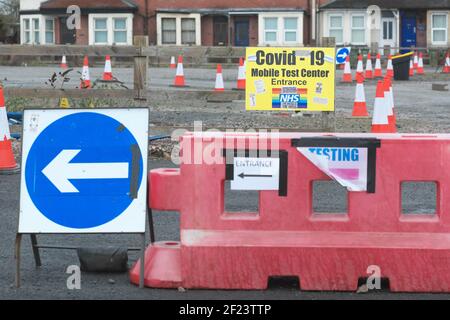 Hereford, Herefordshire, UK - Wednesday 10th March 2021 - The Covid-19 Test and Trace swab testing centre in Hereford is currently closed and out of use. The entrance sign is now covered in anti Covid anti pandemic stickers. Photos Steven May / Alamy Live News Stock Photo