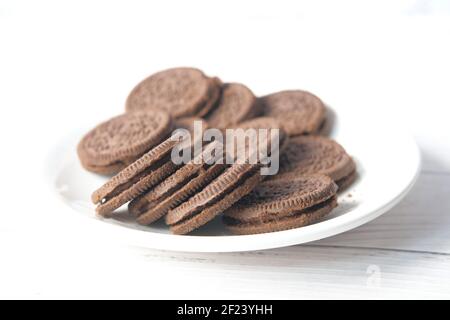 homemade chocolate biscuits on plate isolated on white  Stock Photo