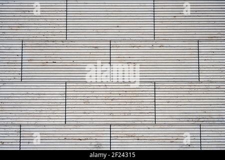Background from a wall made of beige granite slabs Stock Photo