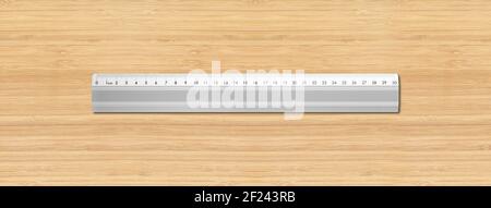 Metal ruler isolated on wooden background Stock Photo