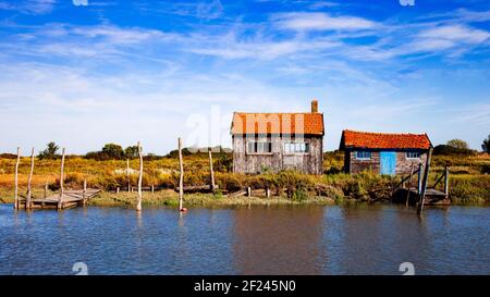 Colorful fishermen cabins and boats in Ile d'Oleron, France Stock Photo