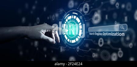 Search Engine Optimisation - SEO - Businessman using Search Engine on virtual screen. Stock Photo