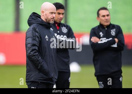 AMSTERDAM, NETHERLANDS - MARCH 10: trainer / coach Erik ten Hag of Ajax, assistant trainer Michael Reiziger of Ajax, assistent trainer Gerald Vanenburg of Ajax during a training session prior to the match against Young Boys at De Toekomst on March 10, 2021 in Amsterdam, Netherlands (Photo by Gerrit van Keulen/Orange Pictures) Stock Photo