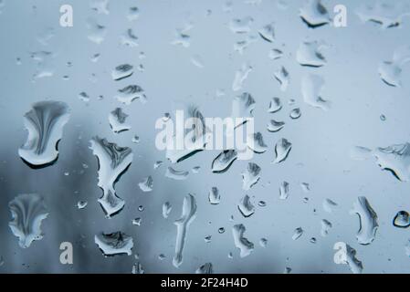 London, UK.  10 March 2021. UK Weather: Raindrops on a window in north west London during a rain shower on a wet day.  The forecast is for changeable conditions with windy and wet weather for the rest of the week.  Credit: Stephen Chung / Alamy Live News Stock Photo