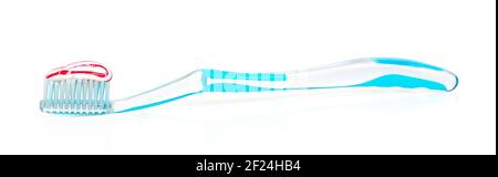 transparent toothbrush with toothpaste isolated on white Stock Photo