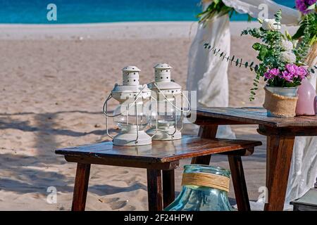 Beautiful decorations of the wedding set on the sand of the beach in the Mediterranean Sea. Stock Photo