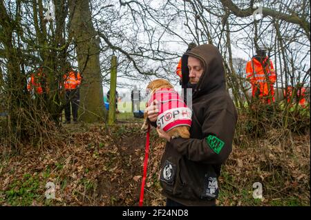 Great Missenden, Buckinghamshire, UK. 10th March, 2021. Early this morning HS2 Ltd and the National Eviction Team evicted Stop HS2 activists from the Save Leather Lane Protest Camp. HS2 were cutting limbs off the oak trees some of which clearly had potential bat roosts in them as well as destroying hedgerows to put up a high security fence. Locals are furious that HS2 will now fell 14 or more of these much loved beautiful oak trees. The controversial High Speed 2 rail link from London to Birmingham is carving a huge scar across the Chilterns which is an AONB. Credit: Maureen McLean/Alamy Live