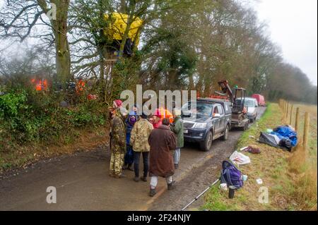 Great Missenden, Buckinghamshire, UK. 10th March, 2021. Early this morning HS2 Ltd and the National Eviction Team evicted Stop HS2 activists from the Save Leather Lane Protest Camp. HS2 were cutting limbs off the oak trees some of which clearly had potential bat roosts in them as well as destroying hedgerows to put up a high security fence. Locals are furious that HS2 will now fell 14 or more of these much loved beautiful oak trees. The controversial High Speed 2 rail link from London to Birmingham is carving a huge scar across the Chilterns which is an AONB. Credit: Maureen McLean/Alamy Live Stock Photo