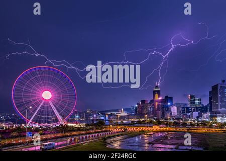 Lightning over city - Victoria Harbour, Hong Kong Stock Photo