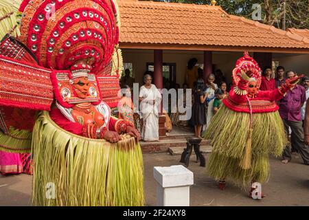 Payyanur, India - December 5, 2019: Theyyam artist perform during temple festival in Payyanur, Kerala, India. Theyyam is a popular ritual form of wors Stock Photo