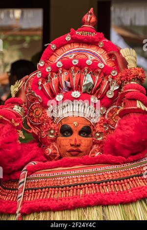 Payyanur, India - December 5, 2019: Portrait of an unidentified Theyyam dancer during temple festival in Payyanur, Kerala, India. Theyyam is a popular Stock Photo