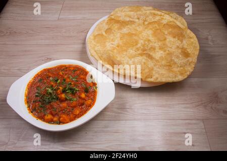 Traditional North Indian fastfood called Chola Bhaatura or Chole Bhature preferred in all meals breakfast, lunch and dinner Stock Photo