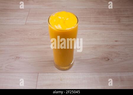 Mango lassi, yogurt or smoothie with turmeric. Healthy pro biotic Indian cold summer drinks Stock Photo