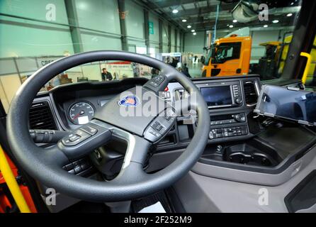 Interior of a new model of a dump truck Scania cabin: seat, wheel, dashboard. Exhibition Heavy Duty 2019. March 20, 2019. Berezovka, Ukraine Stock Photo