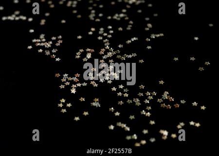 Dark background with shiny silver glitter or confetti. Small stars sparkles for your design project Stock Photo