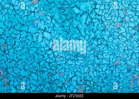 background of the old oily blue paint is cracked by the weather. Texture Stock Photo