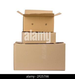 Stack of closed cardboard brown paper boxes isolated on white background Stock Photo