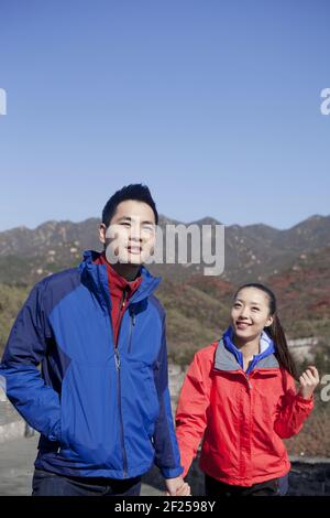 Young couples take pictures in the Great Wall Tourism Stock Photo