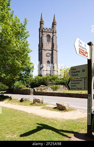 The substantial tower of St Pancras church and village green at Widecombe in the Moor, Devon, UK. Immortalised in the folk song Widecombe Fair. Stock Photo