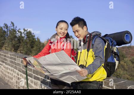 Young couples in the Great Wall tourism map Stock Photo