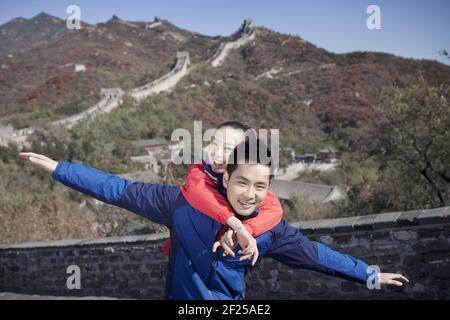 Young couples take pictures in the Great Wall Tourism Stock Photo